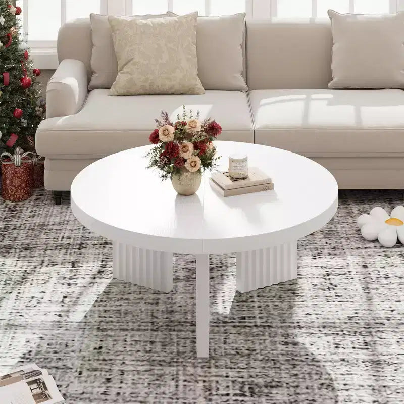 Modern round coffee table  3.3 cm thick top  Elegant fluted legs  Ideal for living room/bedroom  Easy assembly  white wood finish