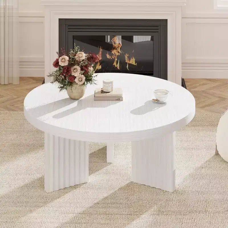 Modern round coffee table  3.3 cm thick top  Elegant fluted legs  Ideal for living room/bedroom  Easy assembly  white wood finish